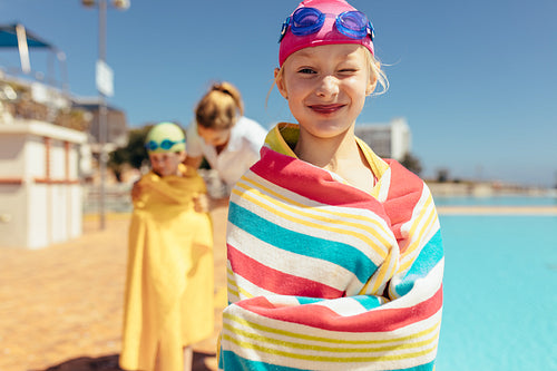 Girl having fun swimming learning session
