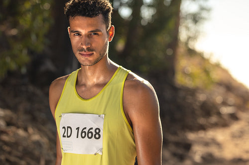 Man competing in mountain trail race