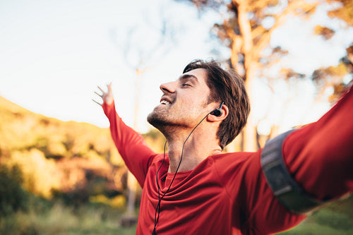 Man relaxing while listening to music