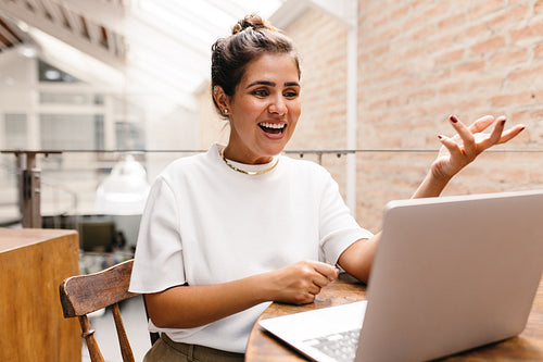 Young businesswoman having an online meeting in her office