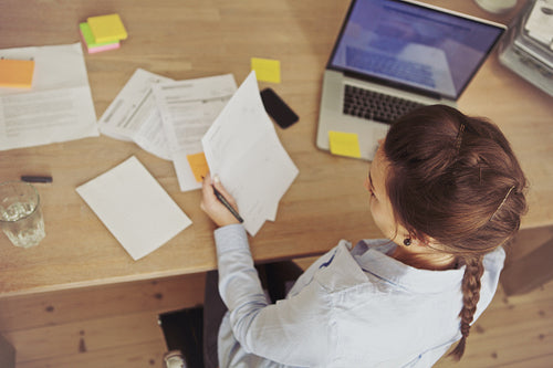 Caucasian businesswoman working at the desk