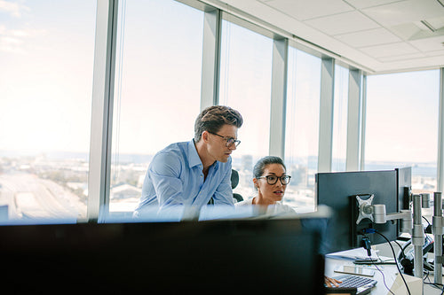 Office worker working together on computer