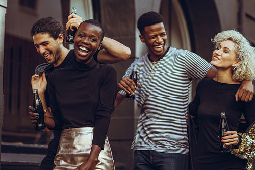 Multi-ethnic group of friends hanging out in the city