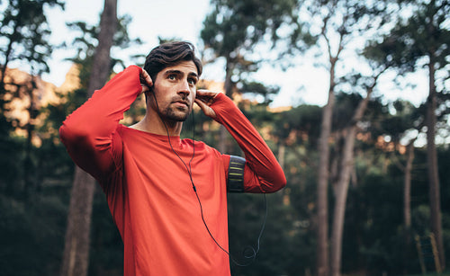 Runner wearing earphones during workout
