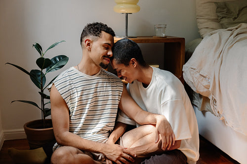 Two people sharing a loving quiet moment in a cozy home setting