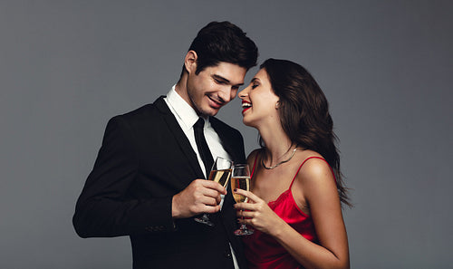 Attractive couple having champagne
