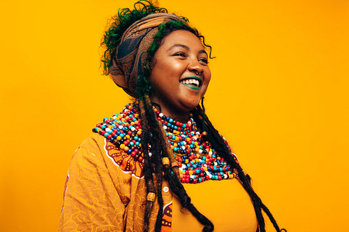 Fashionable young woman smiling in a studio
