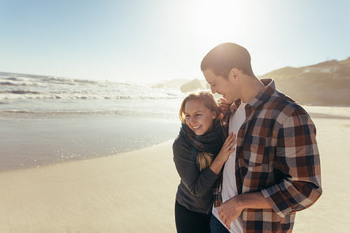 Woman with her boyfriend on the sea shore