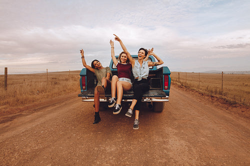 Women enjoying the pickup truck ride