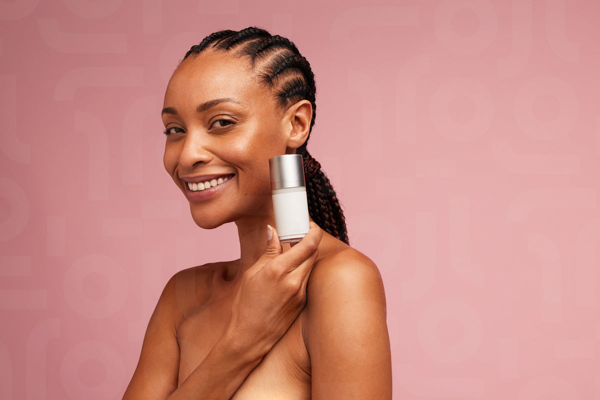 Beautiful female model showing skincare product – Jacob Lund ...