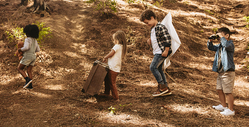 Group of kids with toys in forest