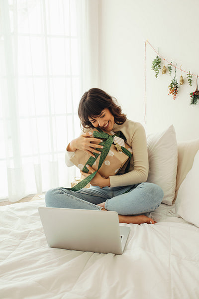 Woman connecting with friends for christmas on video call