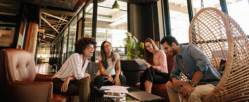 Business team working on new project and smiling