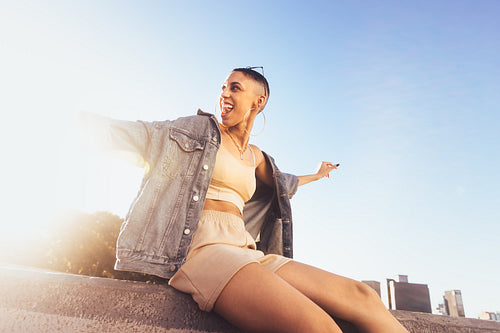 Young woman celebrating in the city