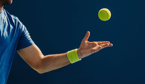 Man practicing padel techniques with a ball