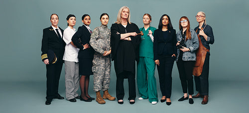 Group of multicultural female workers standing in a studio