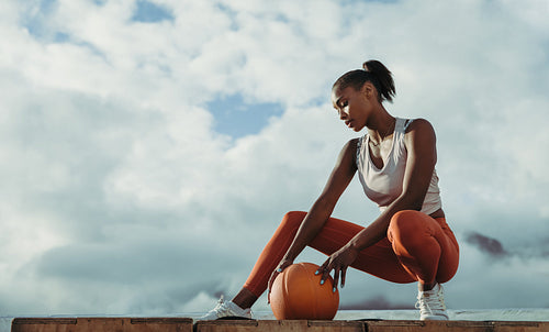 Young female with medicine ball outdoors