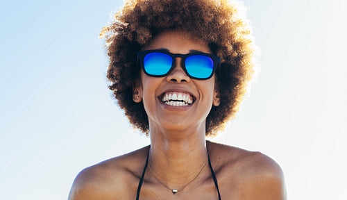Beautiful woman at the beach on a sunny day