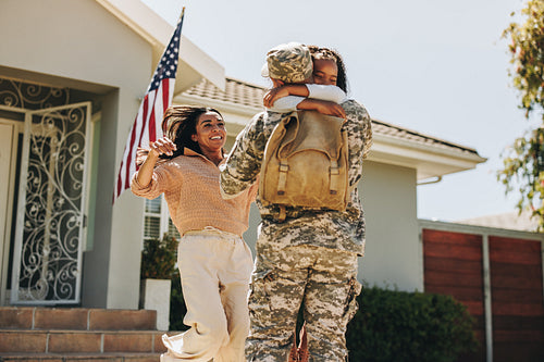 Soldier reuniting with his family at home