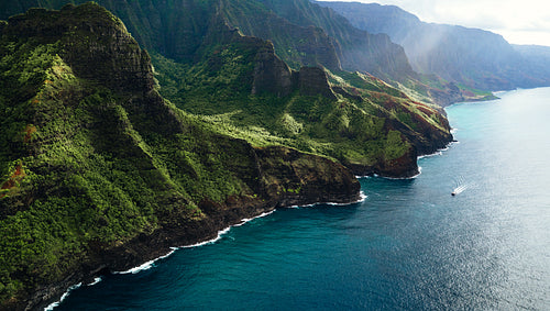 Green mountains and peaceful waters along Na Pali a Hawaiian travel destination