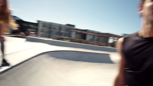 Skaters giving a high five in a skate park