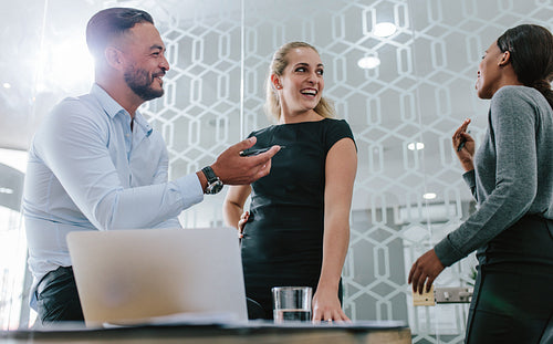 Business team having a casual talk during meeting