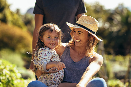 Young family enjoying in their farm