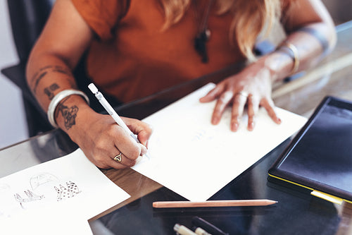 Creative artist at work sitting at her desk