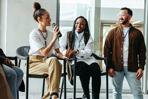 Business woman speaking at a business event with colleagues