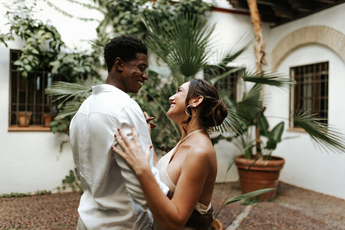 Cheerful couple dancing together in their backyard