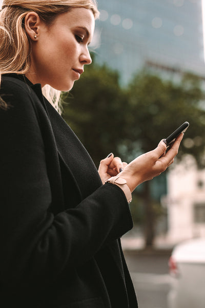 Female commuter using online transportation service