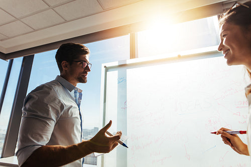 Business colleagues in office discussing work.