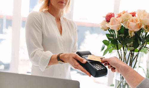Paying through contactless card and NFC technology at flower shop