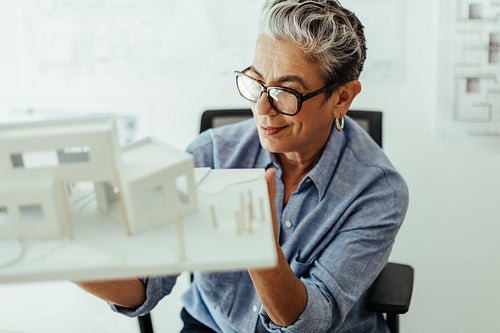 Female engineer's perspective of a sustainable architectural design: Senior architect designing a house building