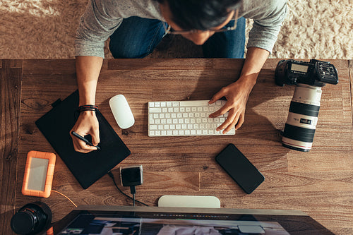 Photographer editing photos after shoot