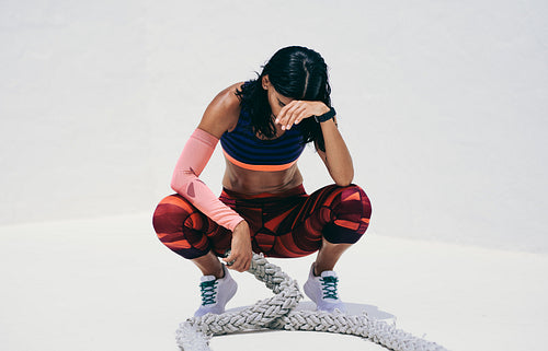 Woman athlete relaxing during her workout