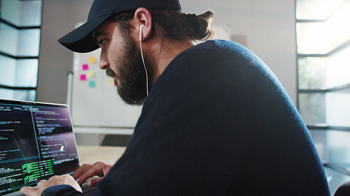 Programmer coding in an office