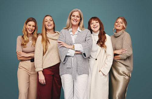 Happy women of different ages standing together