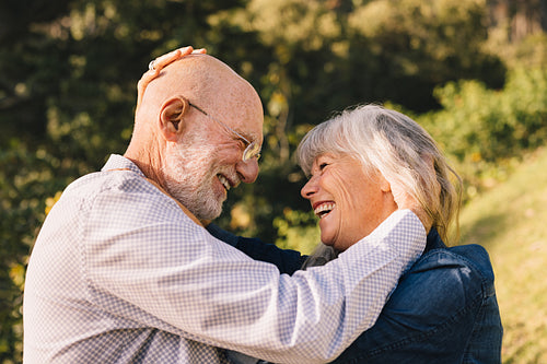 Happy senior couple smiling and expressing their love