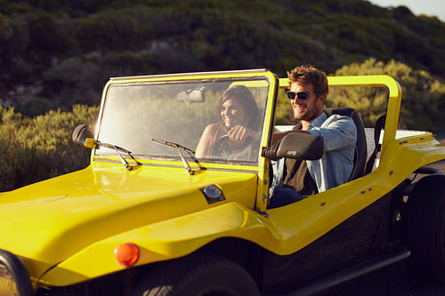 Handsome young man with his girlfriend on a road trip