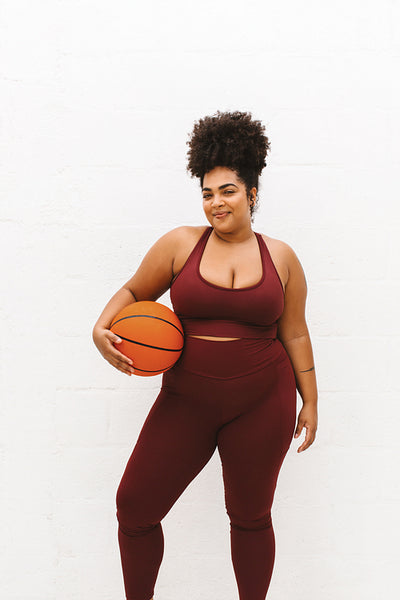 Healthy woman with basket ball
