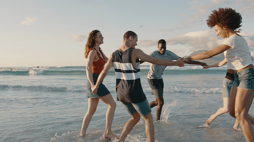 Friends playing childhood games on the beach