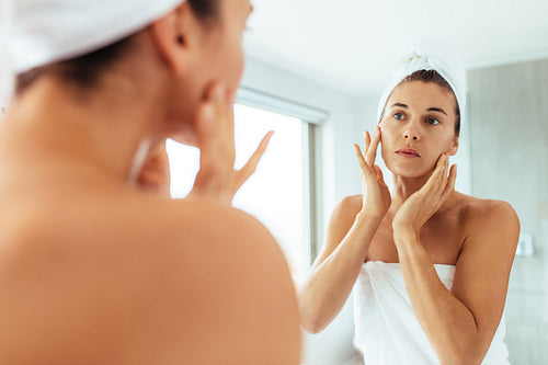 Woman taking care of her body after bath