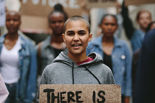 Woman protesting on the city street