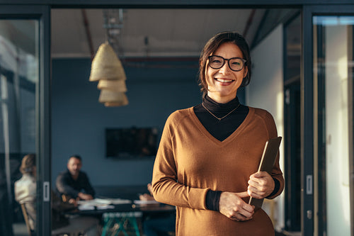 Smiling business woman in casuals at office