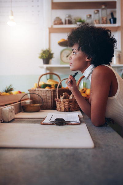 Thoughtful young  juice bar owner