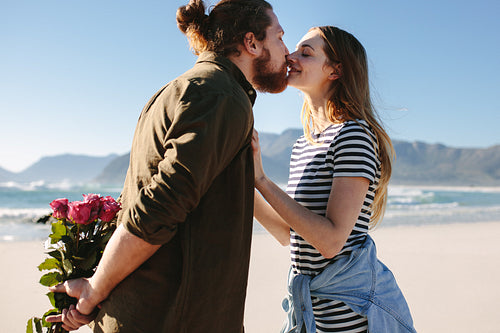 Couple in love kissing on the beach.