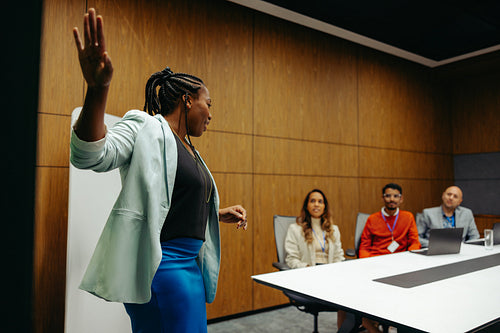 Business presentation in a modern conference room with diverse team
