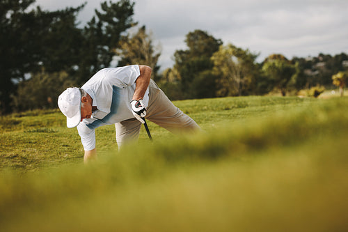 Senior golfer playing on the golf course