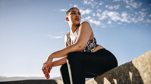 Female relaxing after workout session outdoors